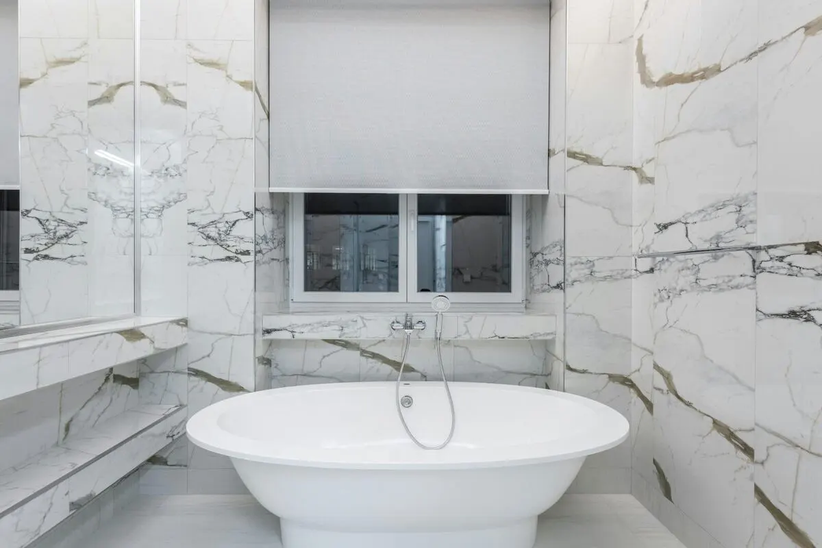Designer bathroom with double vanity and walk-in shower
